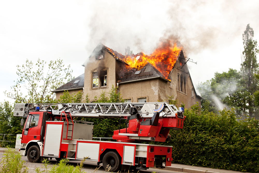 Fire truck arrives at a burning home